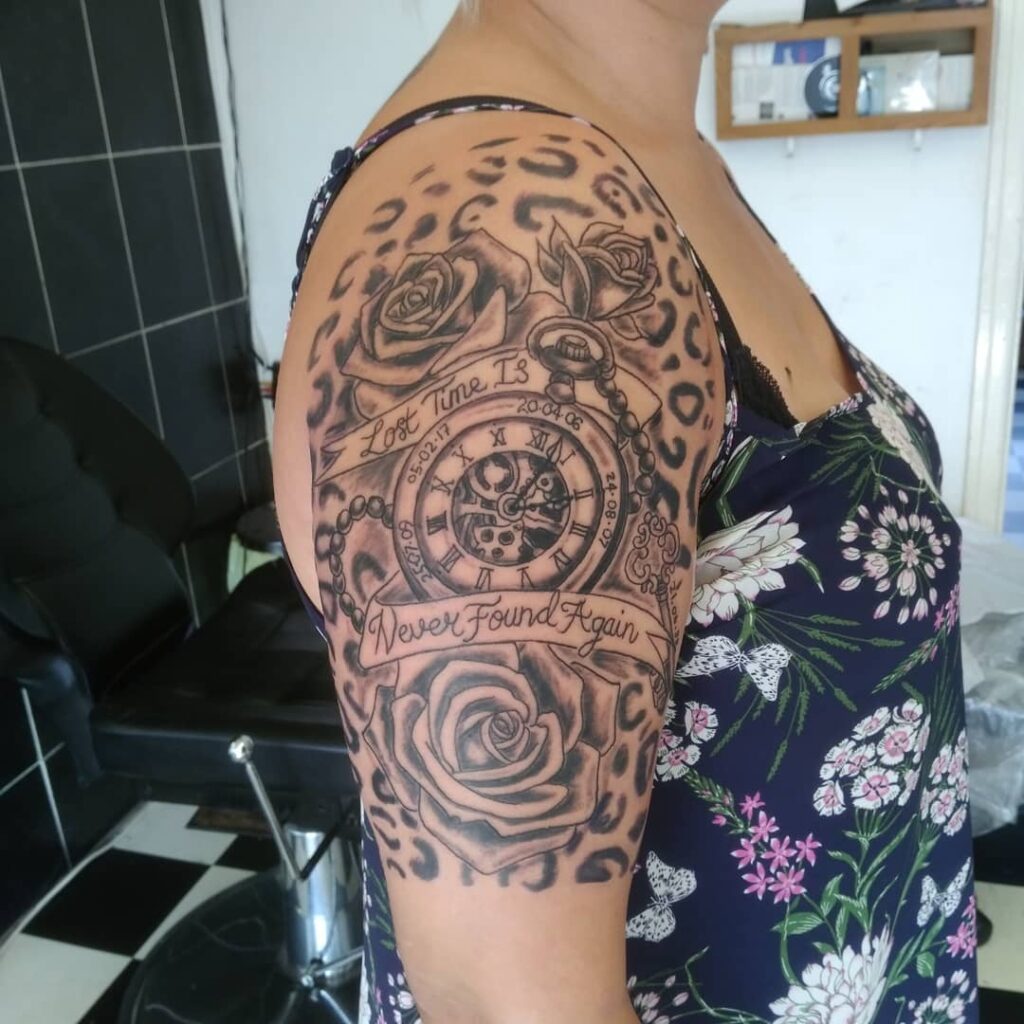 Roses pocket watch and leopard print background arm and shoulder tattoo for women