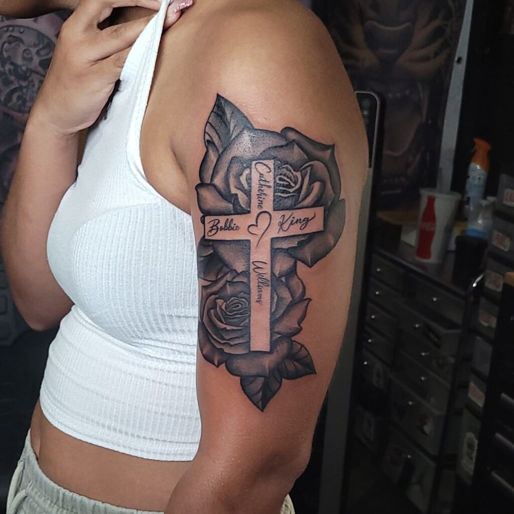 Roses with cross and names tattoo upper half sleeve tattoo - personal and beautiful body art
