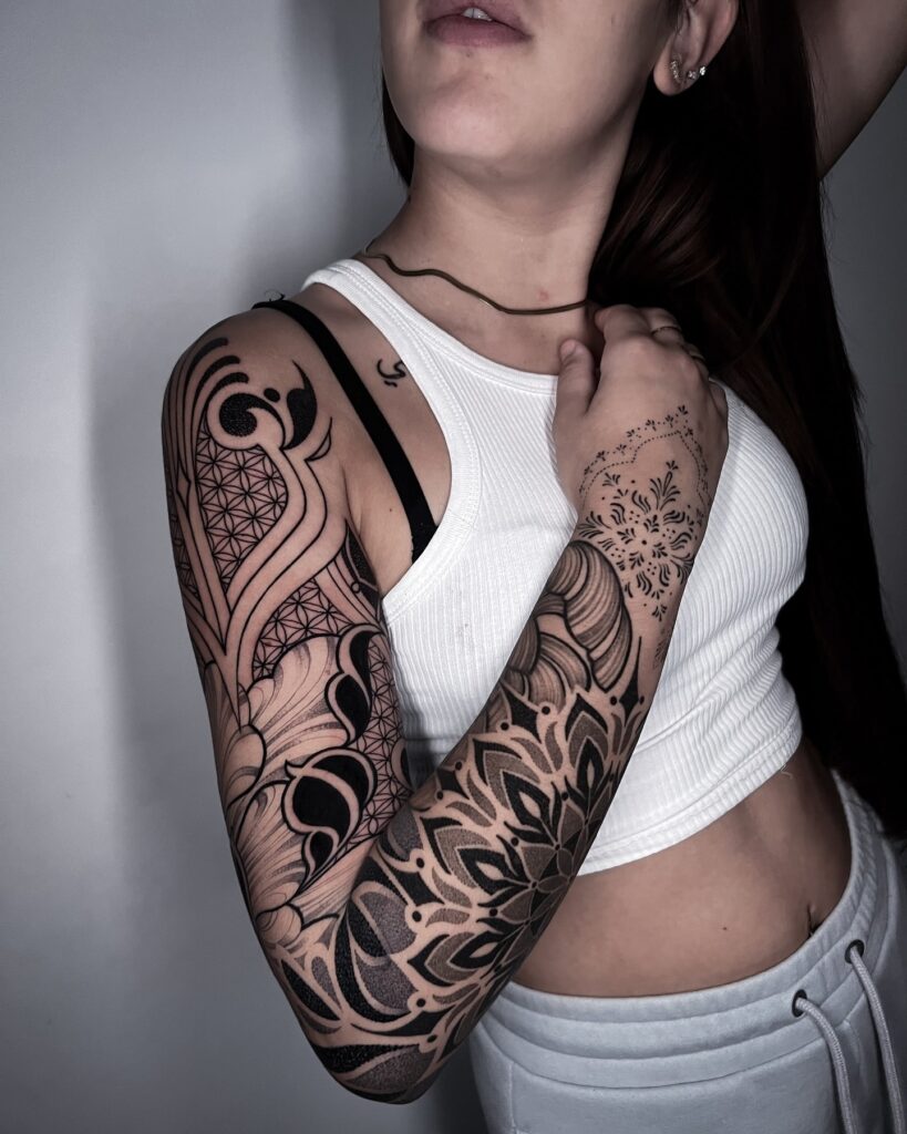 Sacred Geometry Tattoo Sleeve with Mandalas and Bold Blackwork