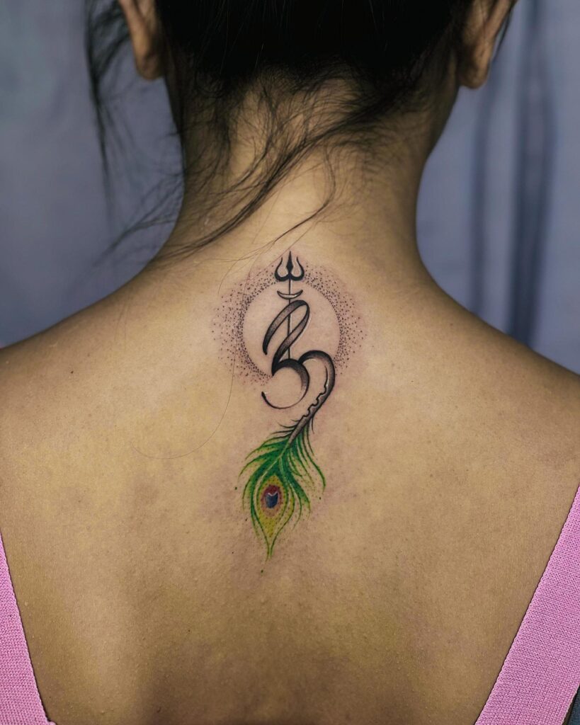 Sacred trio back of the neck tattoo featuring peacock feather, om symbol, and trishul