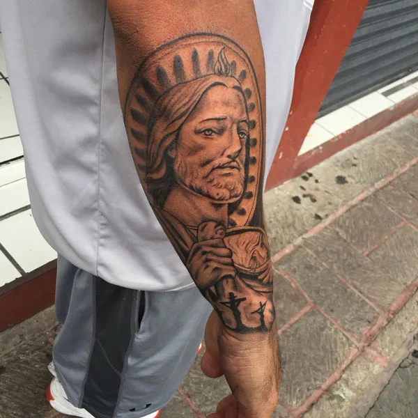 San Judas tattoo forearm