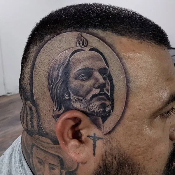 San Judas tattoo on head