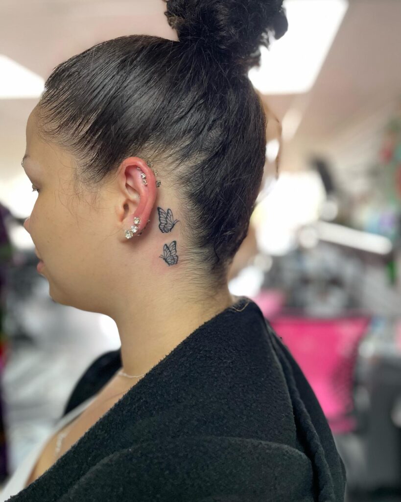 Seeing double twin butterflies tattooed behind the ear