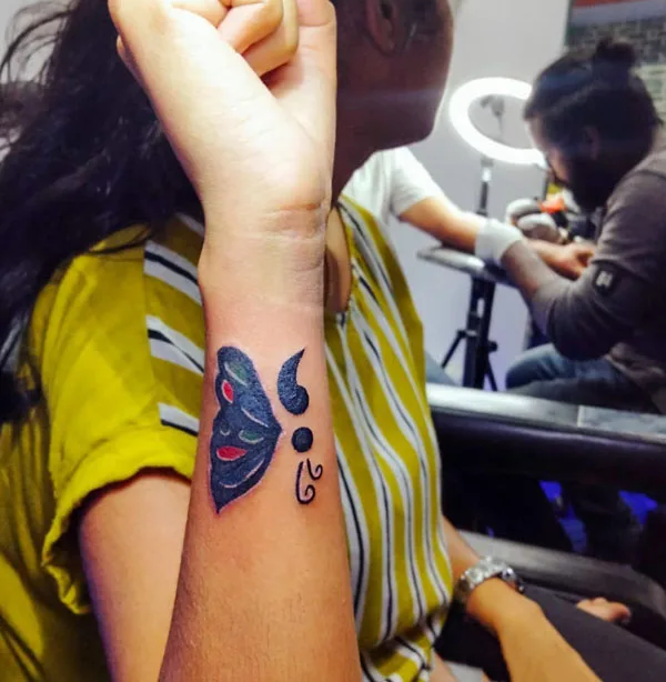 Semicolon butterfly hand tattoo