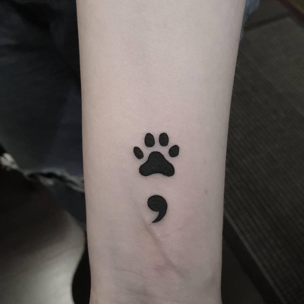 Semicolon Paw Print Tattoo on the Inner Wrist: Paw-fect Symbolism