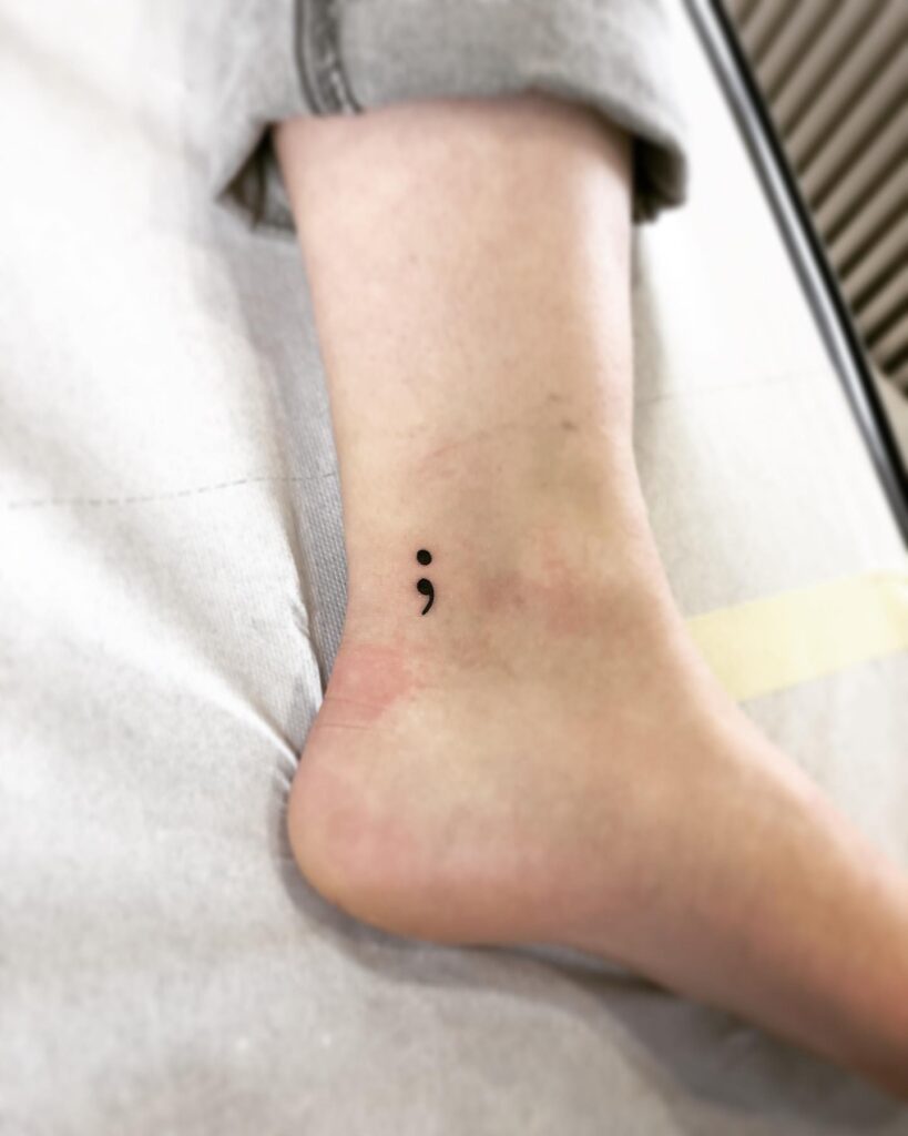 Semicolon Tattoo Near the Ankle for Girls: Black Work Charm