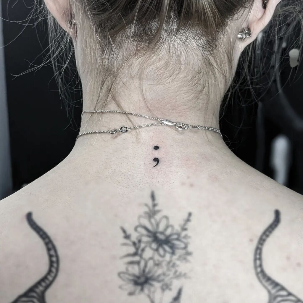 Semicolon Tattoo on the Back of the Neck for Women: Graceful Nape