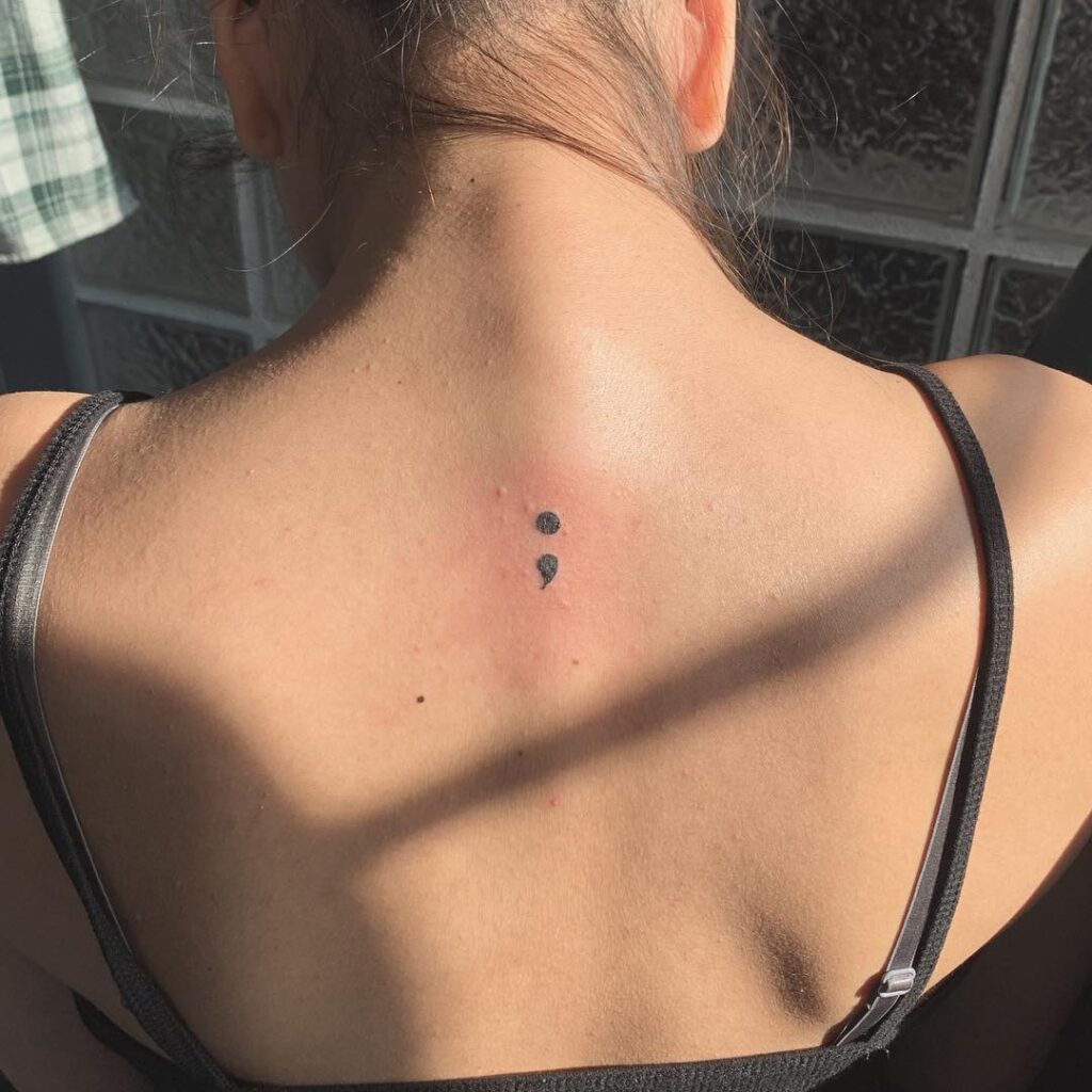 Semicolon Tattoo on the Back Side for Women: Feminine Grace