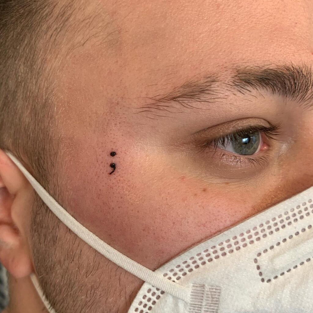 Semicolon Tattoo on the Face for Men: Intriguing Expression
