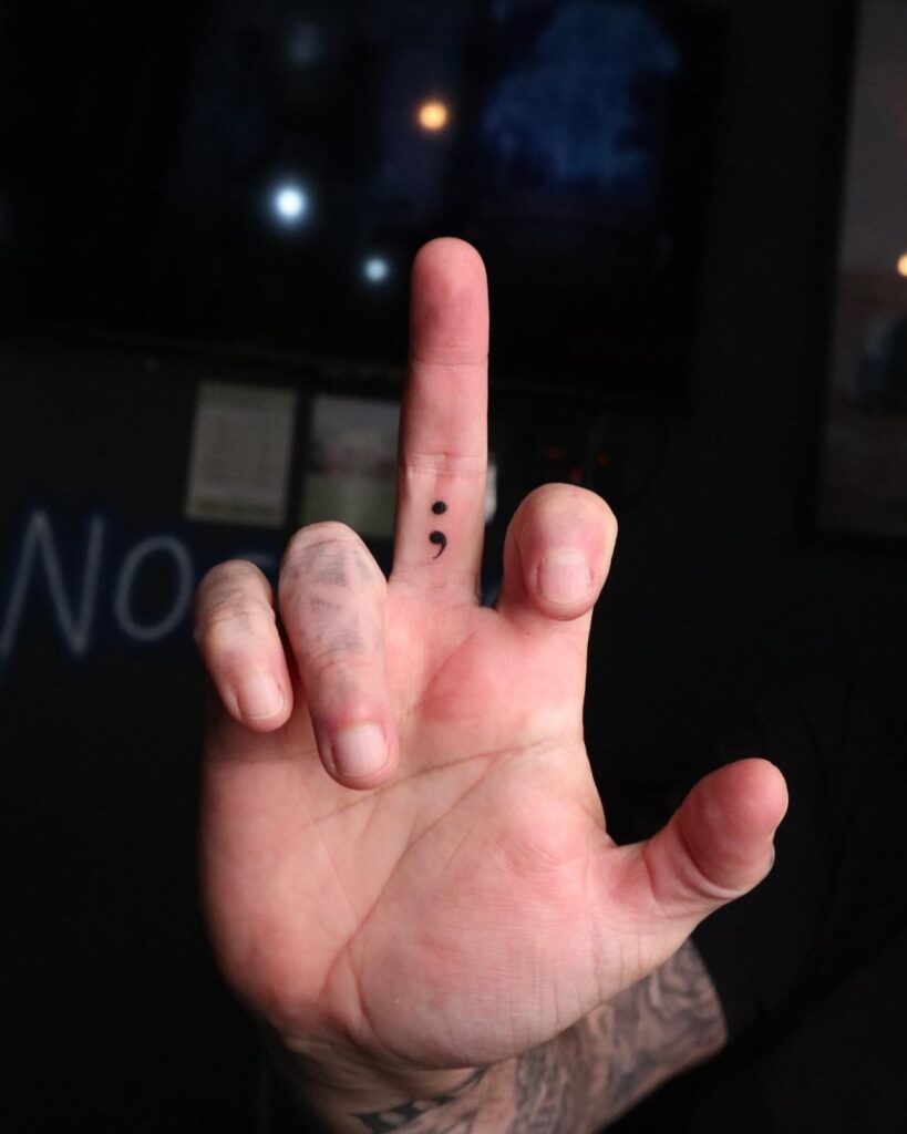 Semicolon Tattoo on the Inner Middle Finger, a Tiny Reminder: Finger Whispers
