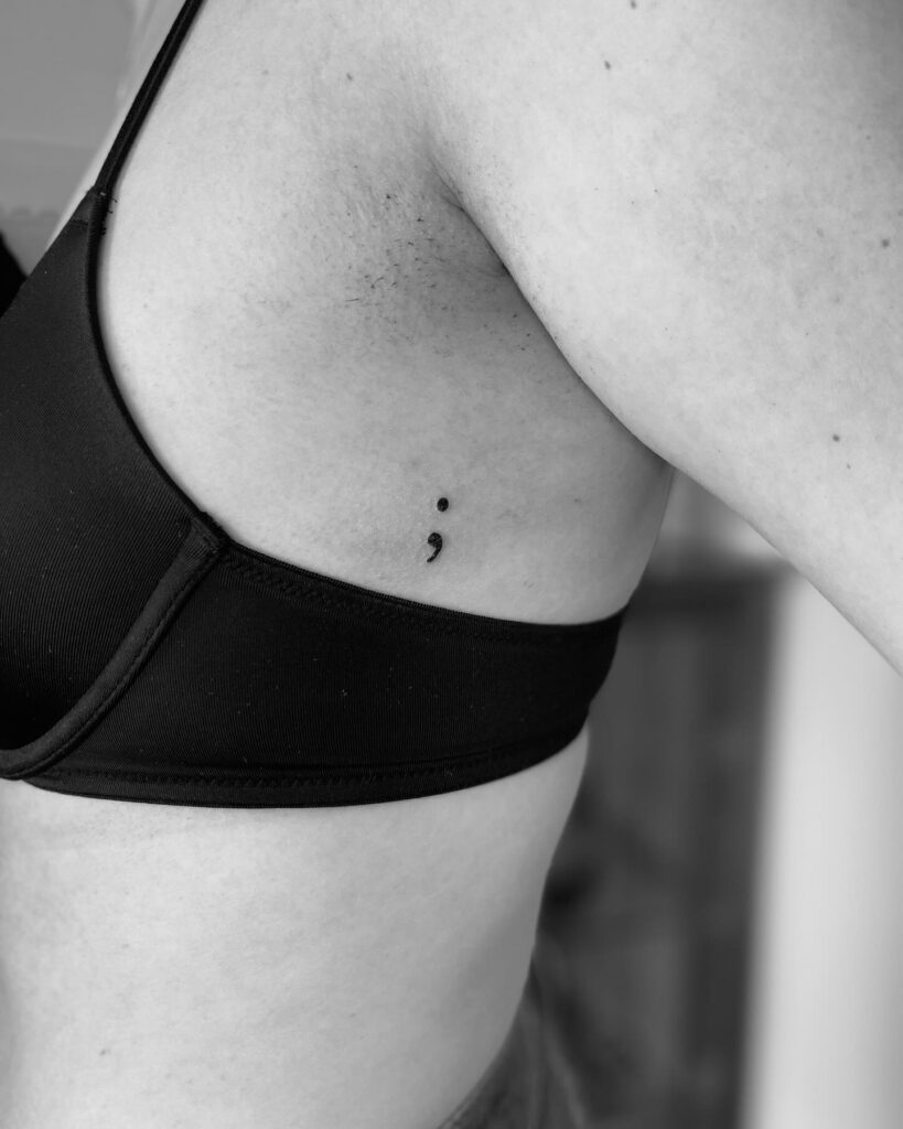 Semicolon Tattoo on the Rib for a Graceful Statement: Subtle Elegance