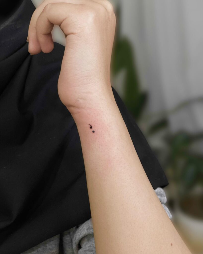 Semicolon Tattoo on the Side of the Wrist for Females: Tiny Elegance
