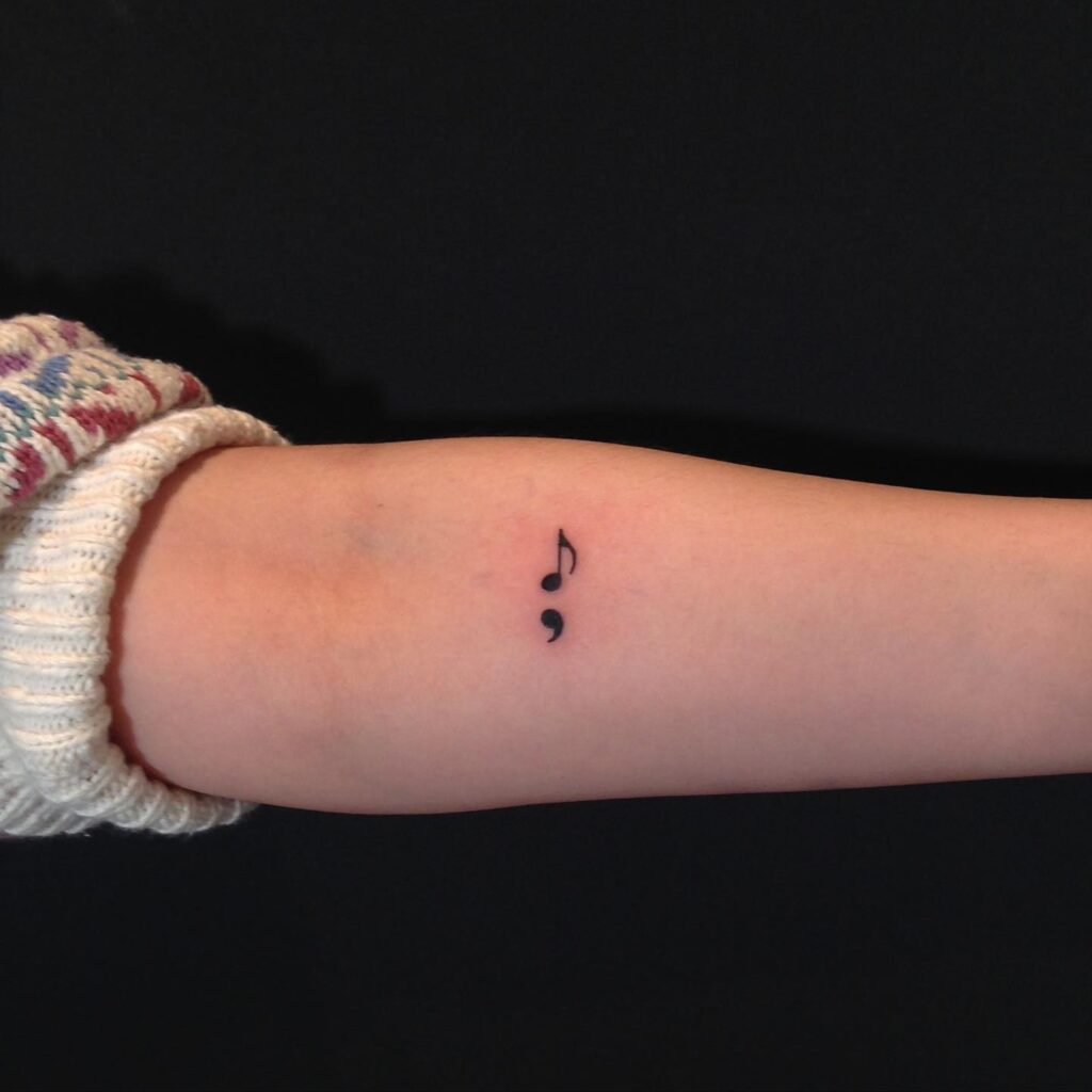 Semicolon Tattoo with a Touch of Music on the Forearm: Musical Pause