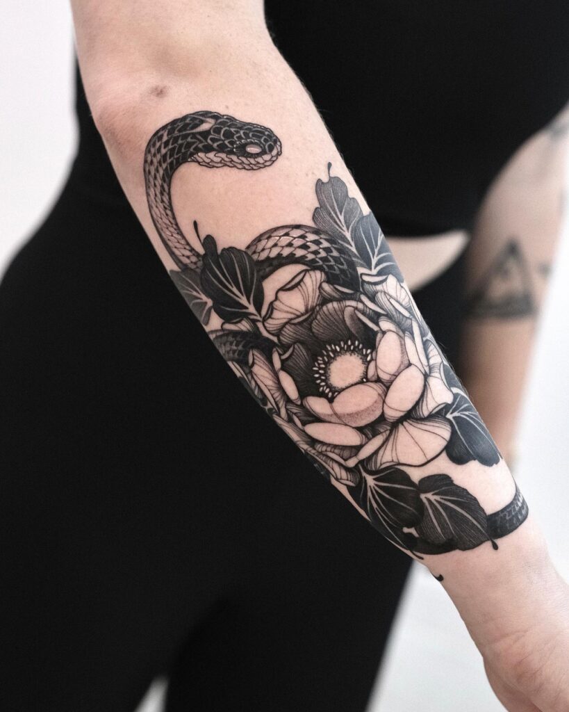 Serpentine elegance forearm snake and peony tattoo