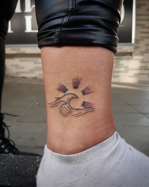 Shaded Rays of Sun With Lined Wave Tattoos Ideas for Foot