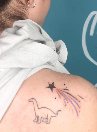 Shooting Star With Baby Dinosaur Tattoo Shooting Star With Baby Dinosaur Tattoo