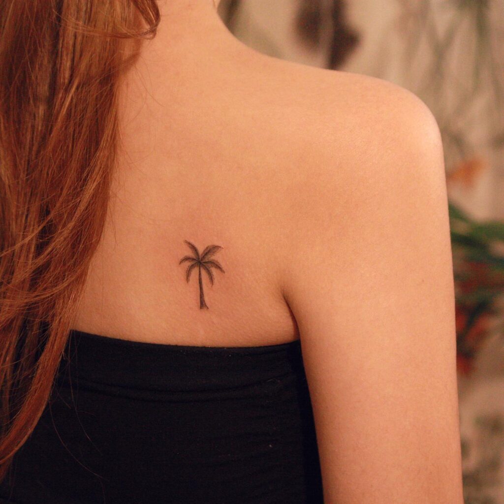 Shoulder Blade Palm Tree Tattoo for a Subtle Back Accent: Tropical Whispers