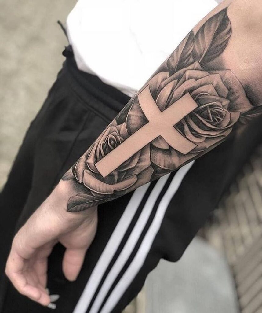 Side forearm half sleeve stunning cross with roses - a mesmerizing tattoo display