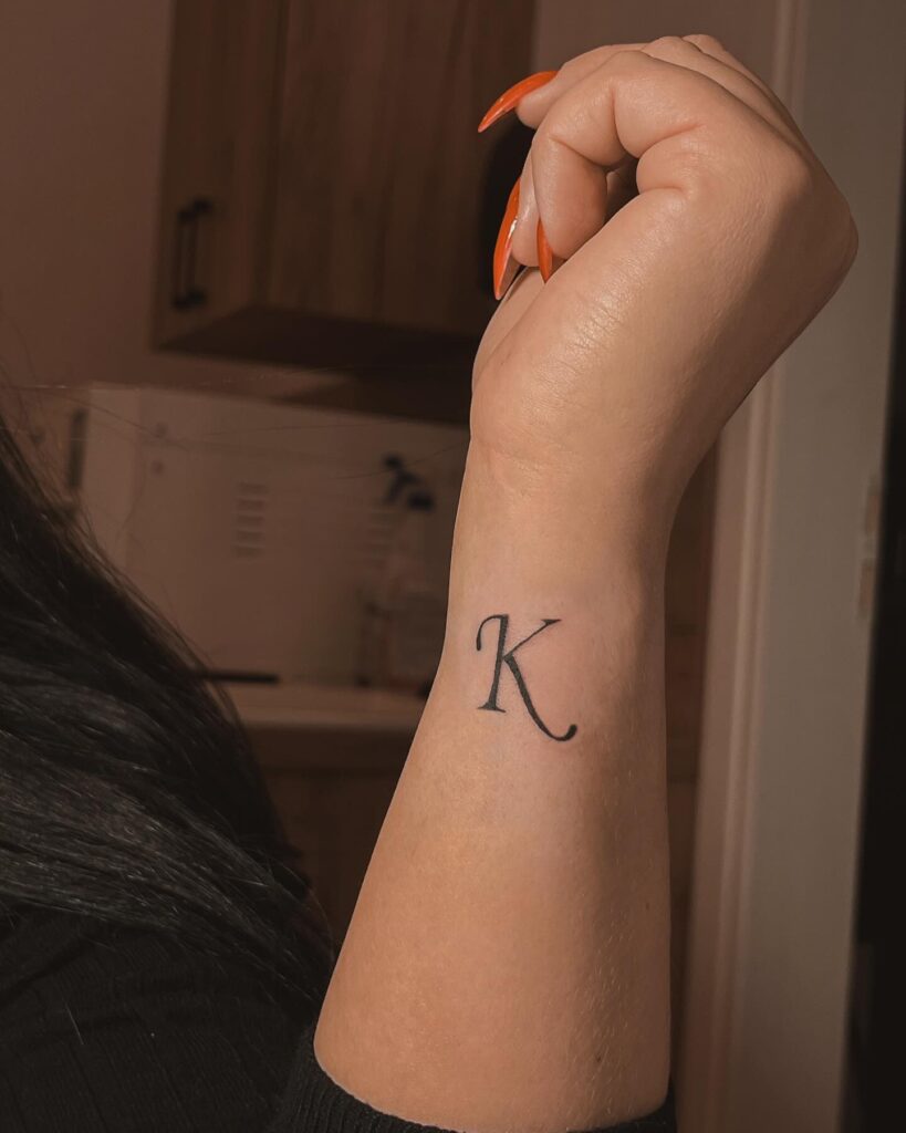 Side Lettering 'K' Tattoo: Forearm Expression