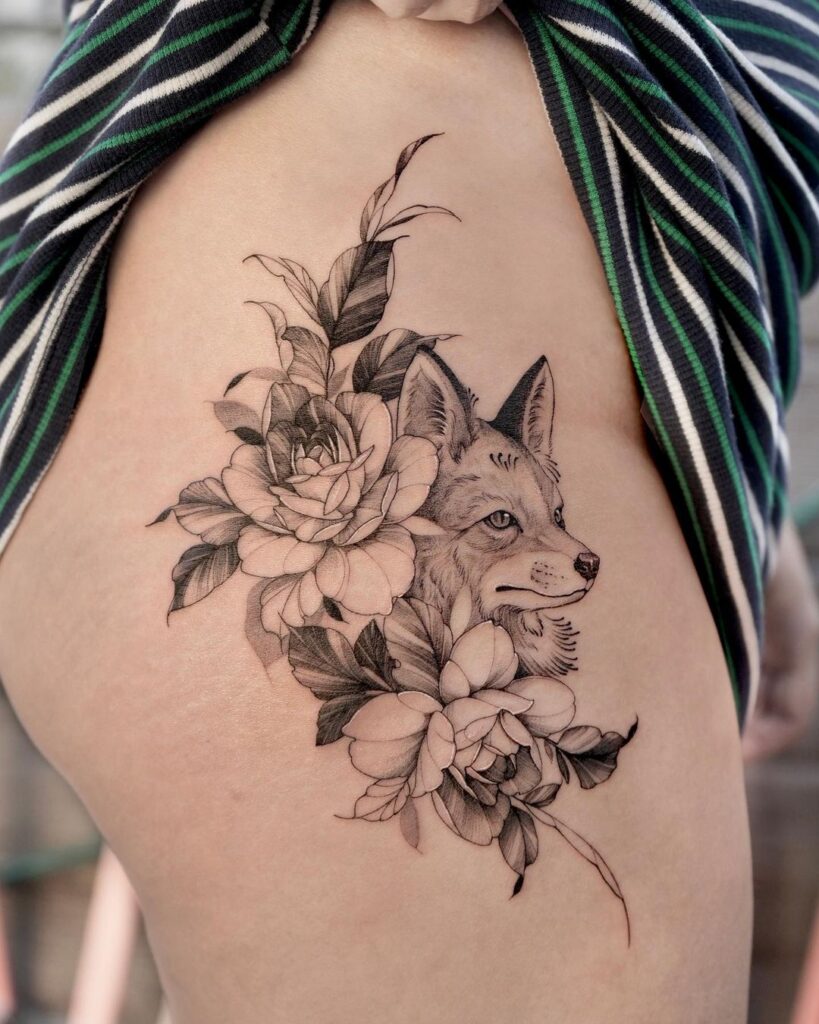 Side thigh fox and flowers tattoo fox face adorned with floral beauty