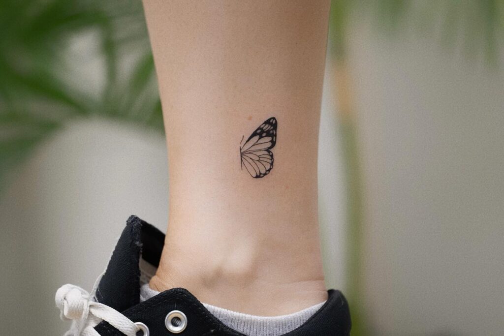 Side View Flying Butterfly Tattoo on the Leg, Clean and Simple: Traditional Flight
