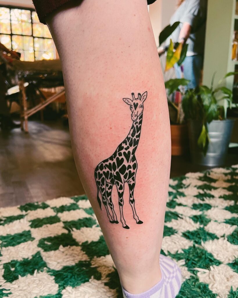 Side View Giraffe Tattoo on the Calf with Heart Patterns: Giraffe Glam 