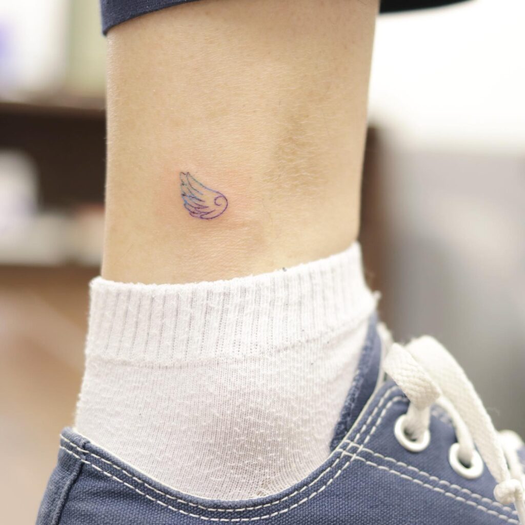 Side View Wings Tattoo Above the Ankle, a Feather-Light Accent: Tiny Soar