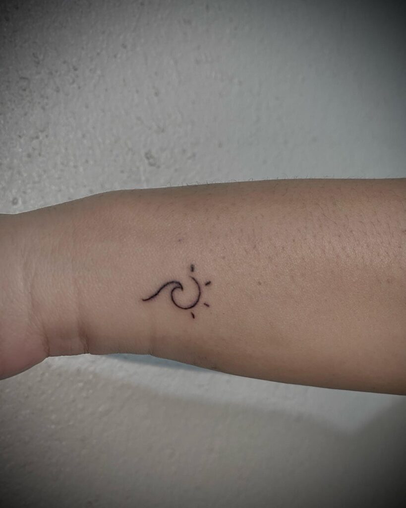 Side wrist wave and sun tattoo ideas for female artful and thoughtful body art