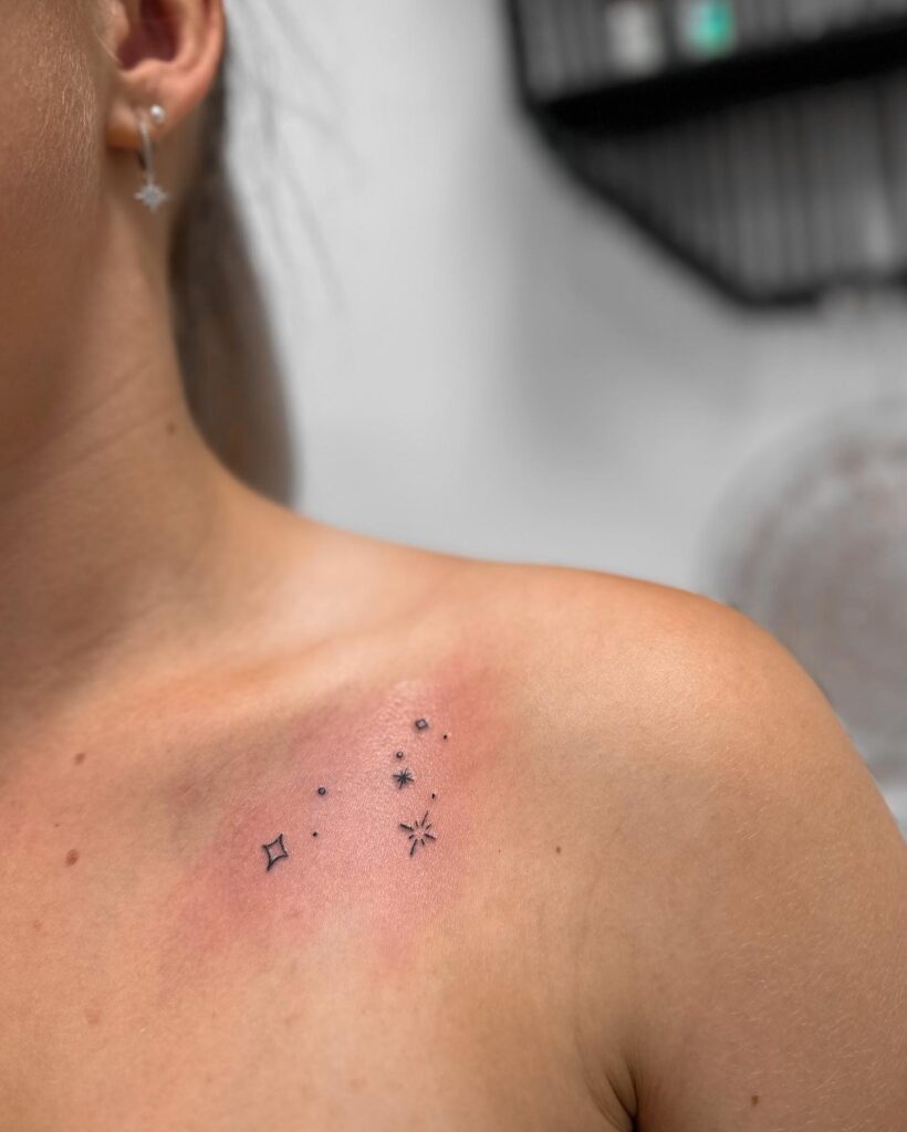 Sign of the stars small thin stars in a unique shoulder tattoo