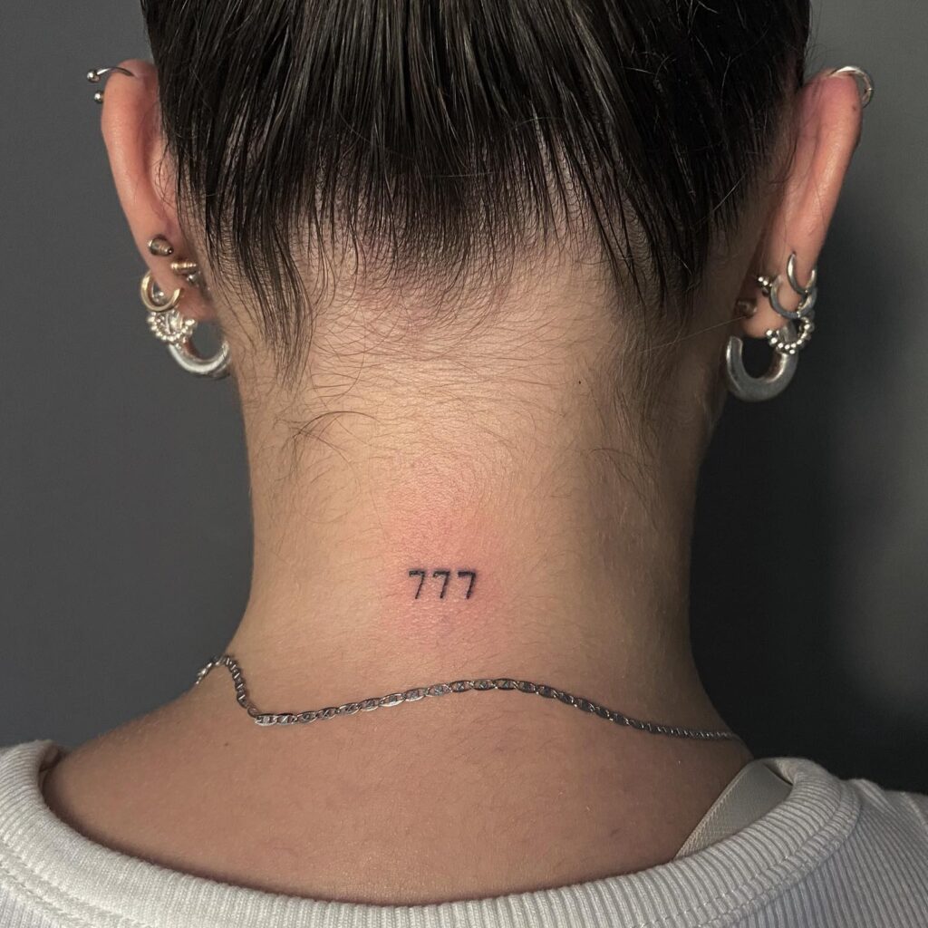Simple 777 tattoo on the back of the neck a subtle expression of luck nape numerals 