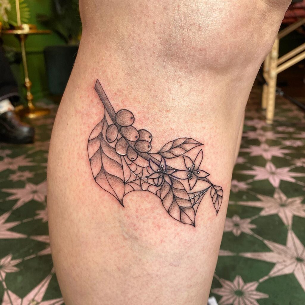Simple Coffee Plant Tattoo Below the Knee Embracing Natures Brew