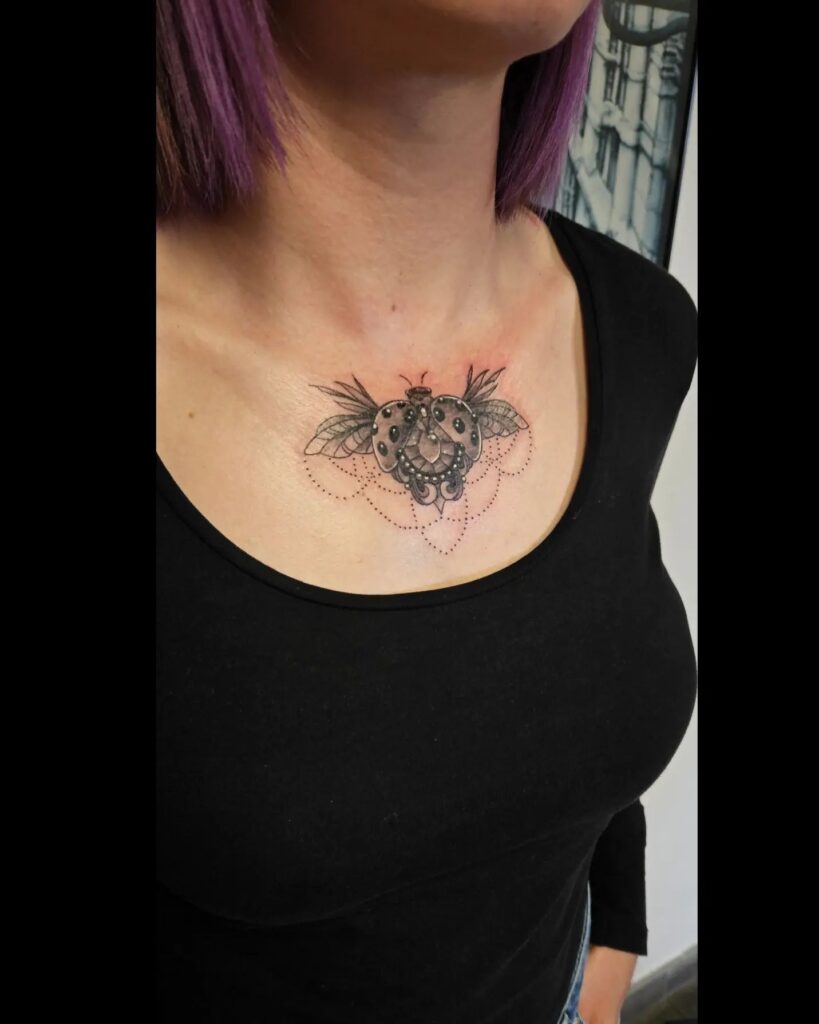 Simple Ladybug Tattoos on Middle Chest for Females Subtle and Elegant