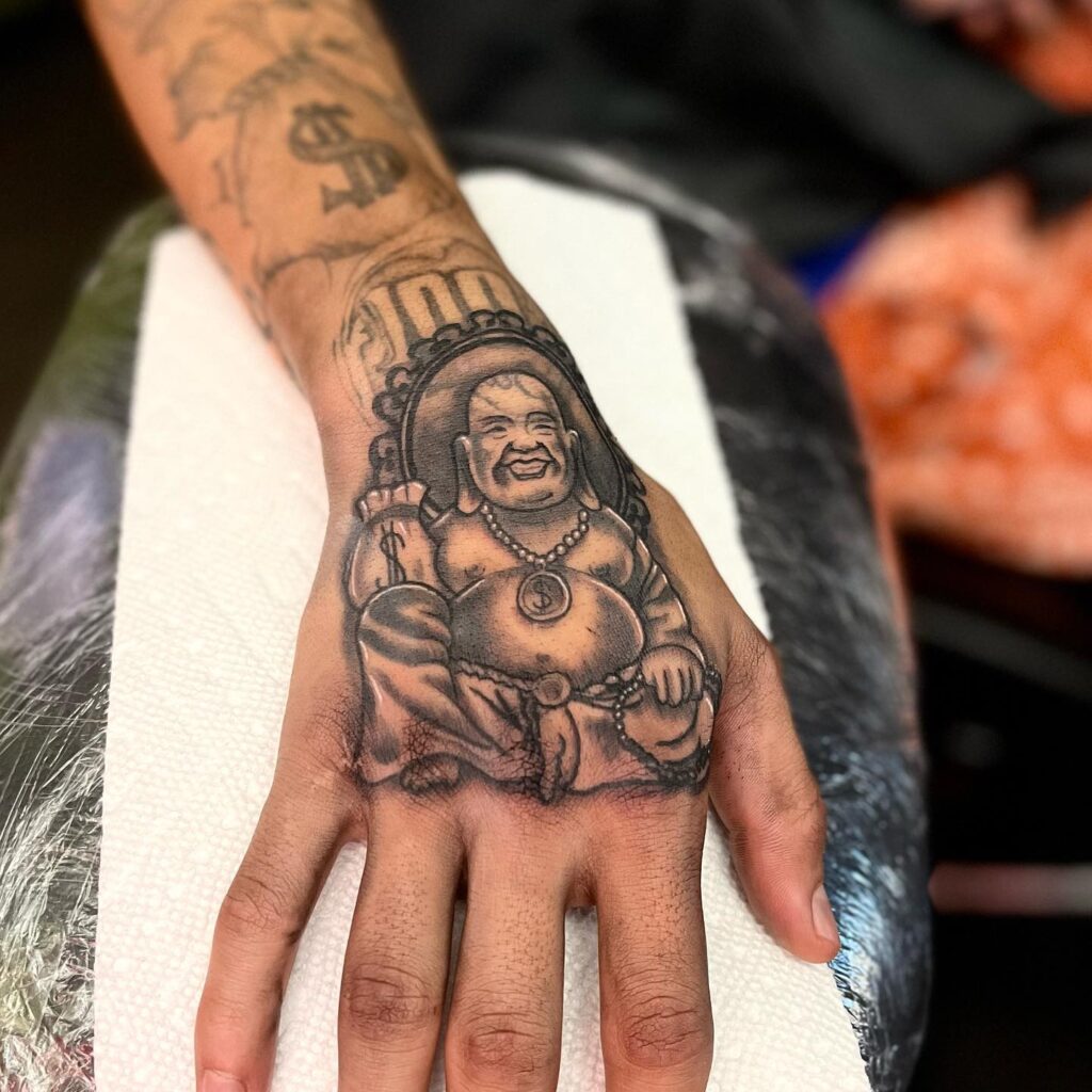 Simple Laughing Buddha Tattoo on wrist