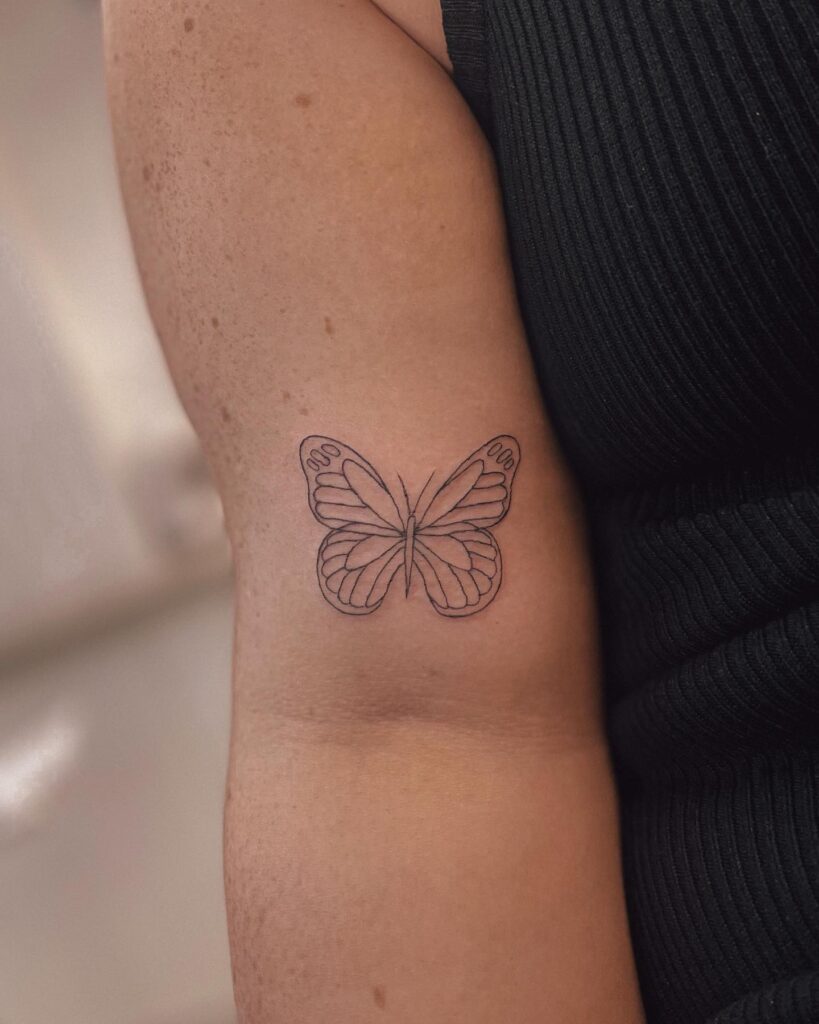 Simple Outline butterfly Tattoo on Arm Graceful Freedom