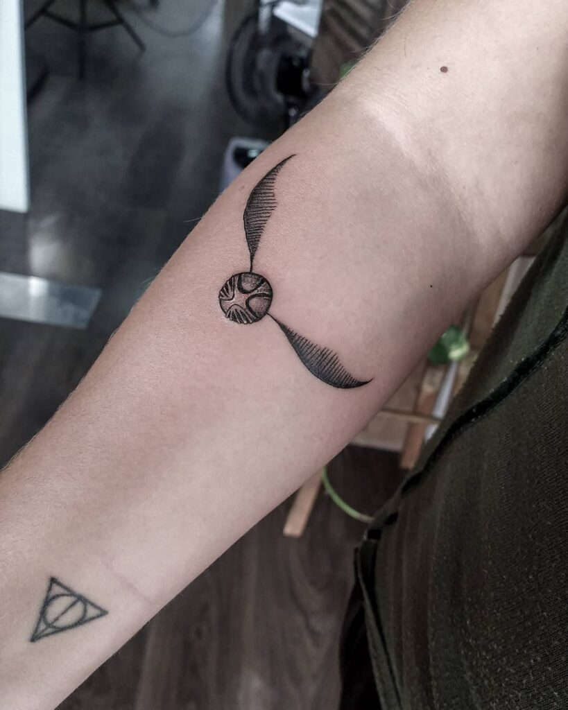 Simple and easy forearm enchantment golden snitch tattoo ideas for women