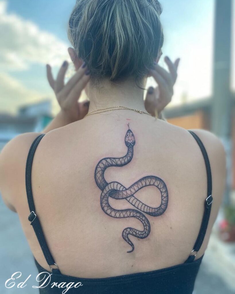 Simple Black Work Cobra Tattoo on the Back, a Little Snake Adding Intrigue: Subtle Venom