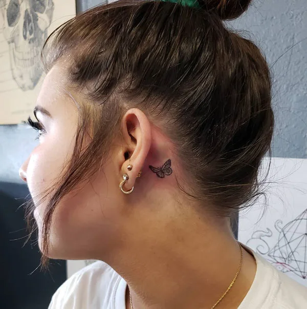 Simple butterfly tattoo behind ear