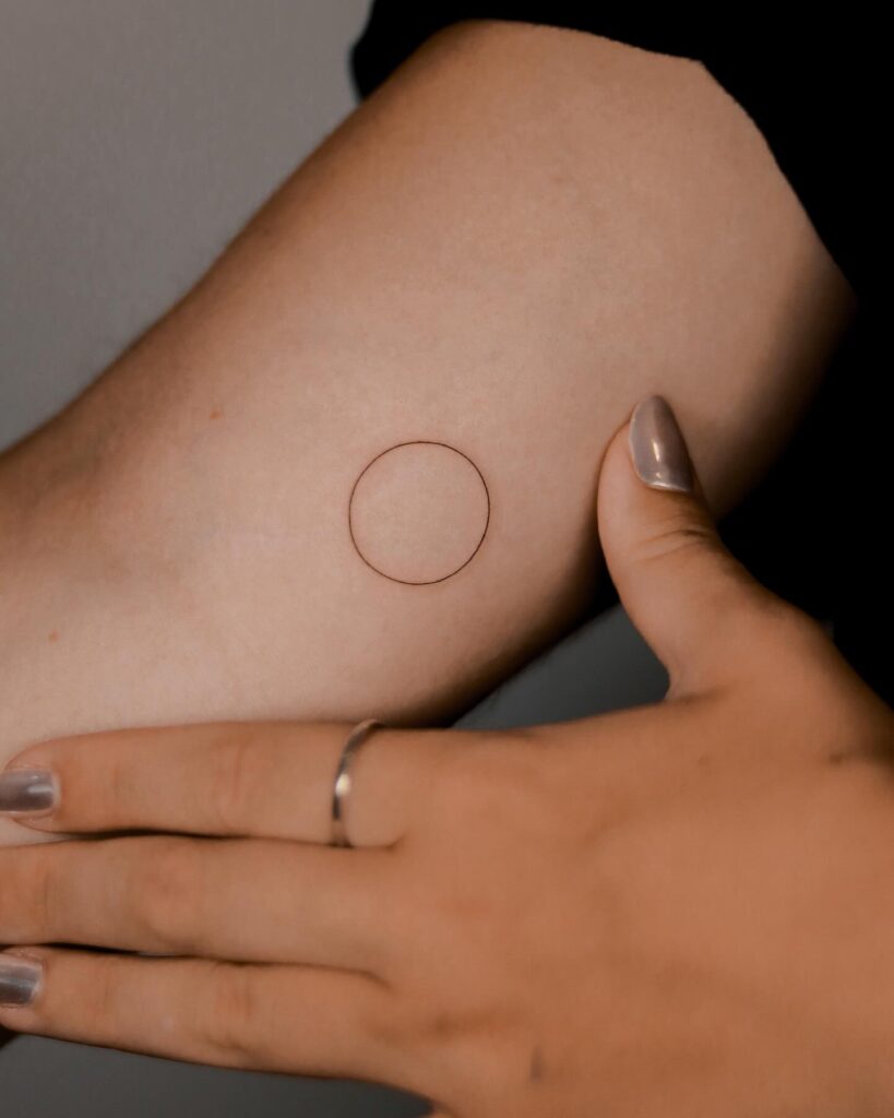 Simple Circle Tattoo on the Inner Arm, a Whisper-Thin Outline: Minimal Magic