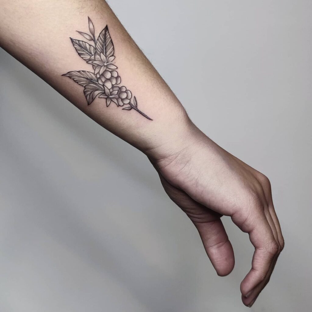 Simple coffee plant hand tattoo for girls