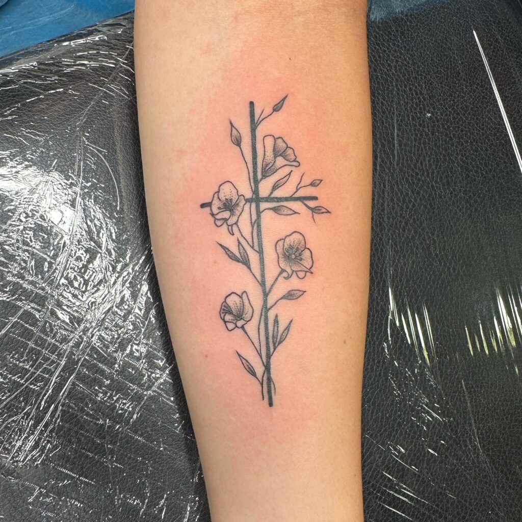 Simple Cross and Flower Arm Tattoo for Female Artistic Harmony