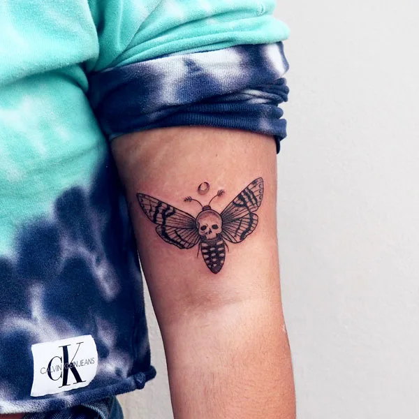 Simple death moth tattoo