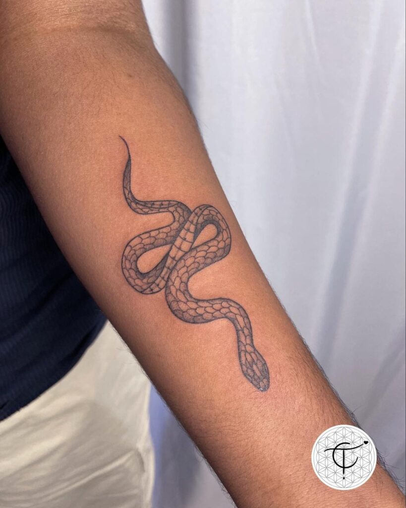 Simple king cobra tattoo on the forearm minimalistic serpent ink