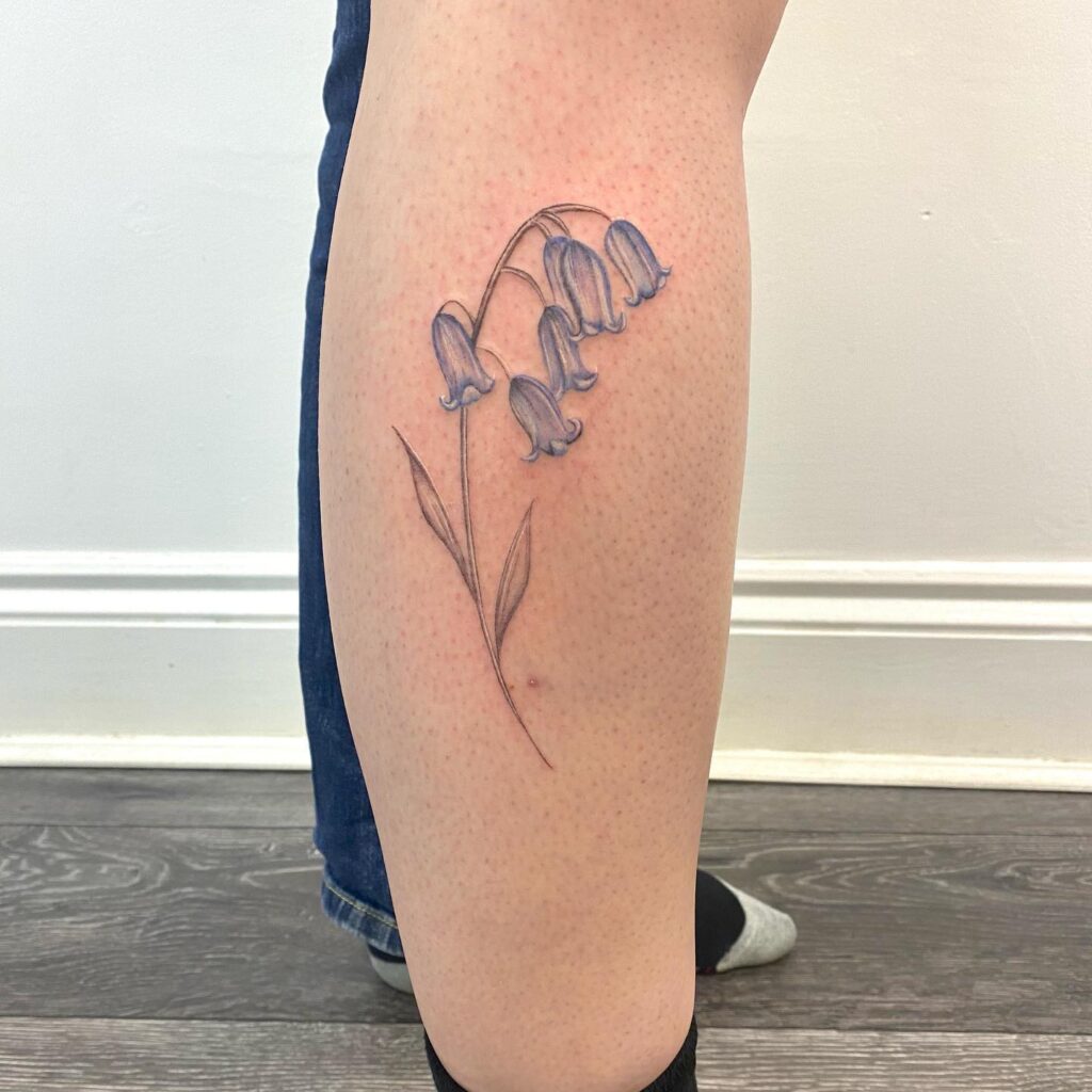 Simple lower leg bluebell tattoo ideas minimalistic florals