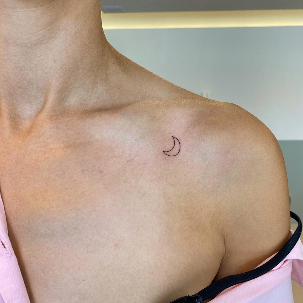 Simple Outline Crescent Moon Tattoo on the Collarbone: Subtle Moon Magic