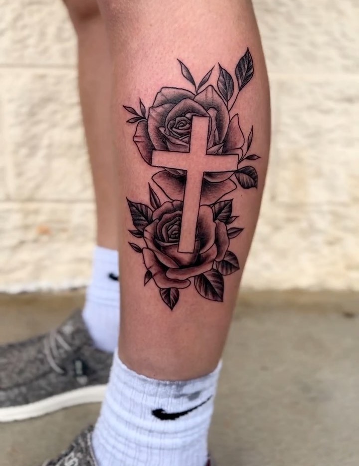 Simple side lower leg cross with rose tattoo for females