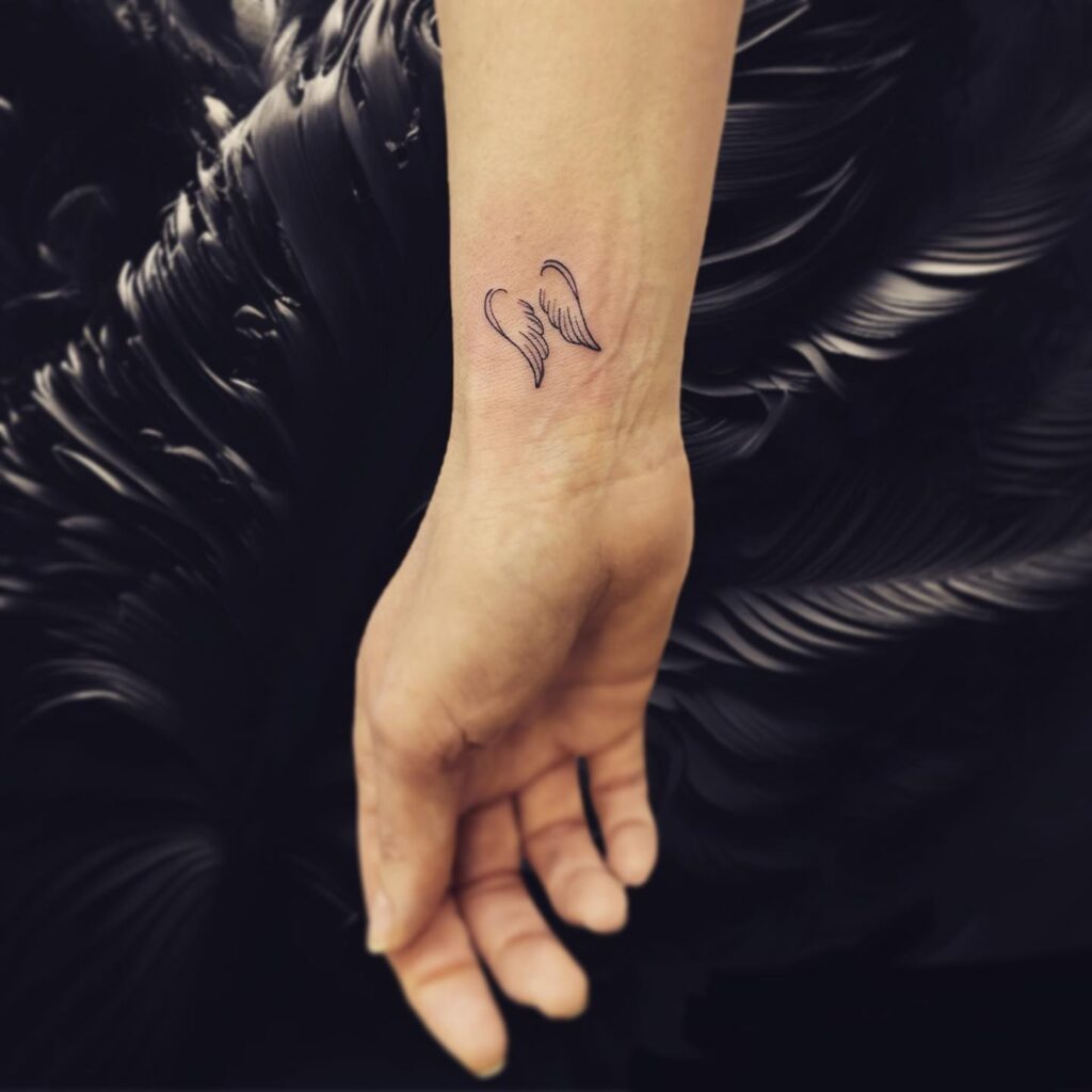 Simple Small Inner Wrist Wings Tattoo for Girls: Whispers of Flight