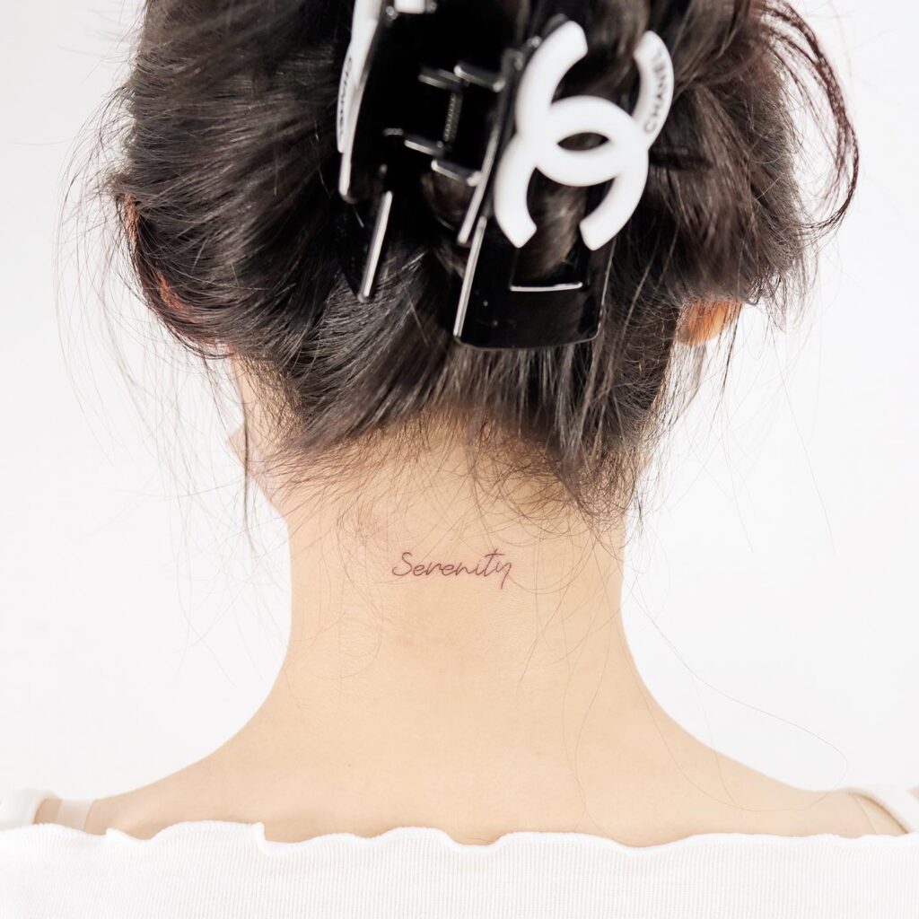 Simply serene word tattoo on neck's back tiny delicate serenity essence