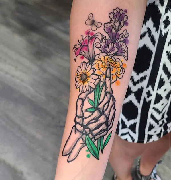 Skeleton hand tattoo on forearm