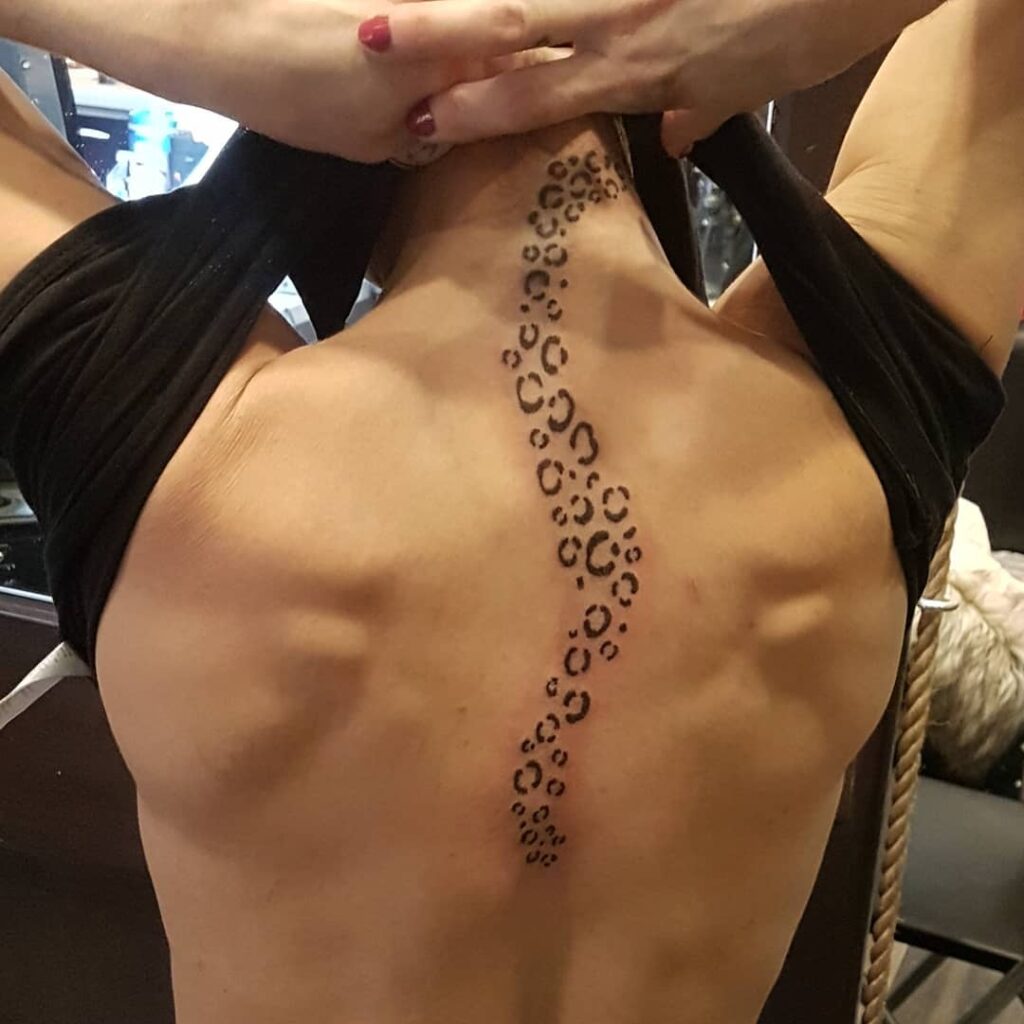 Sleek spots leopard print neck tattoo ideas
