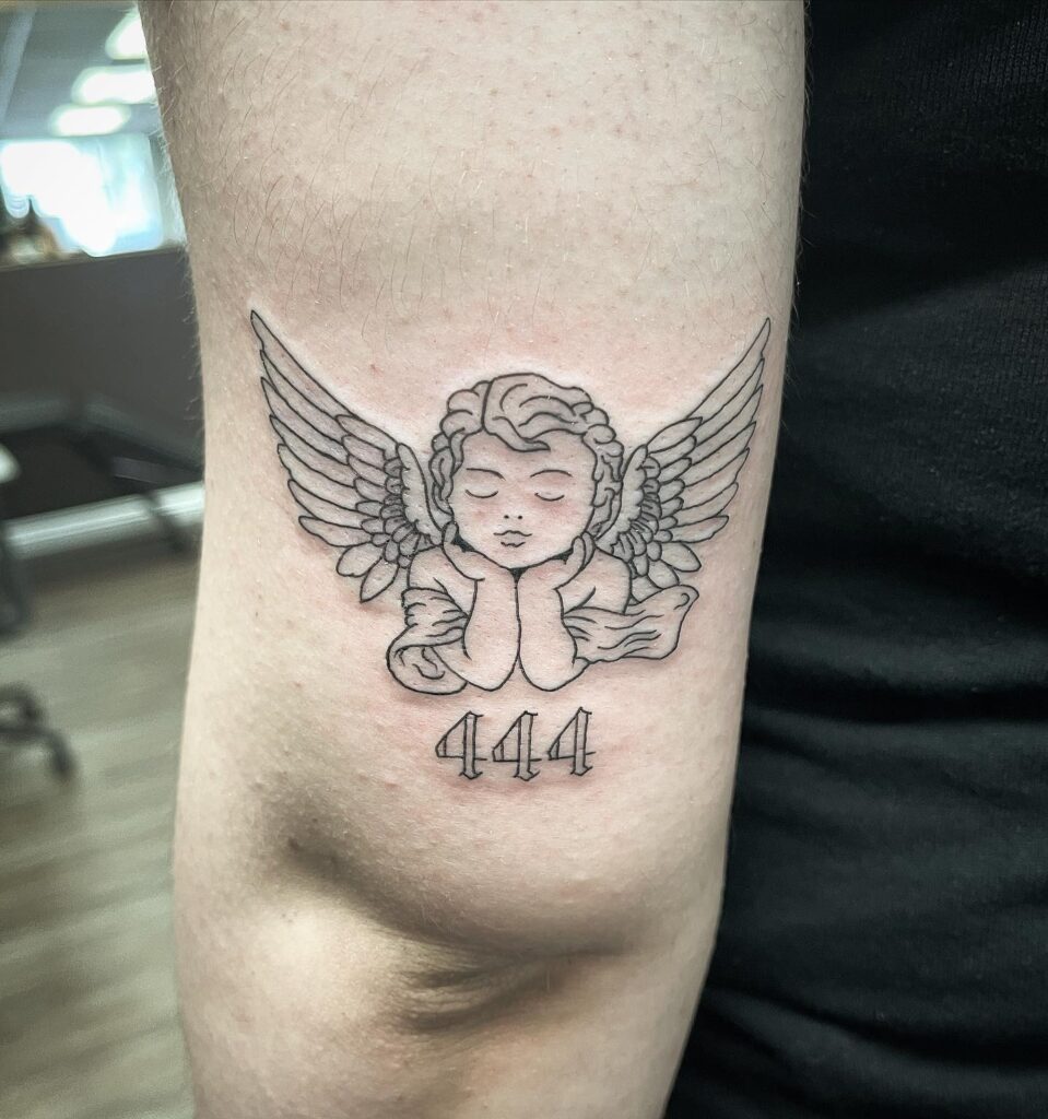 Sleeping Baby Angel with 444 Number Tattoo Above the Elbow: Divine Numbers